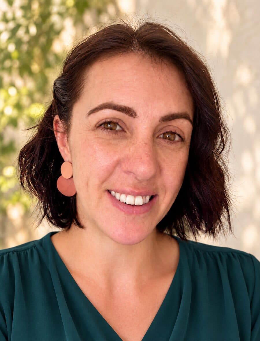 Becky, founder of Confident Brains, smiling in a teal blouse